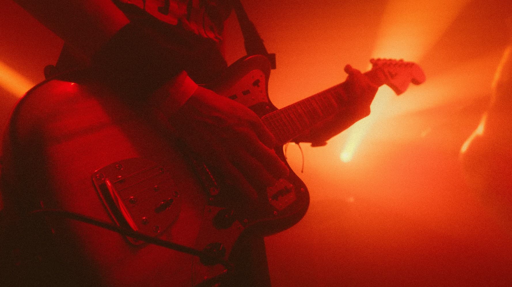 Red Lit Guitarist Concert